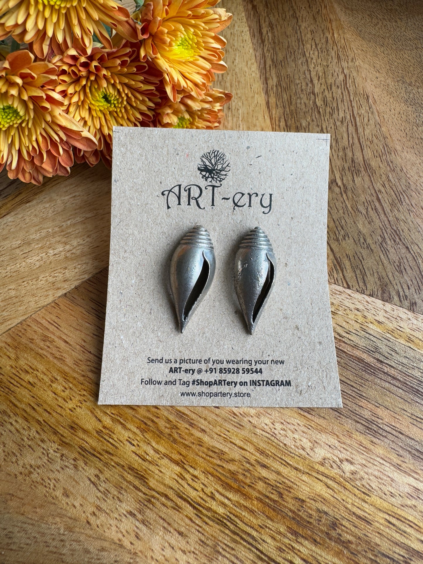 Look alike silver conch earrings