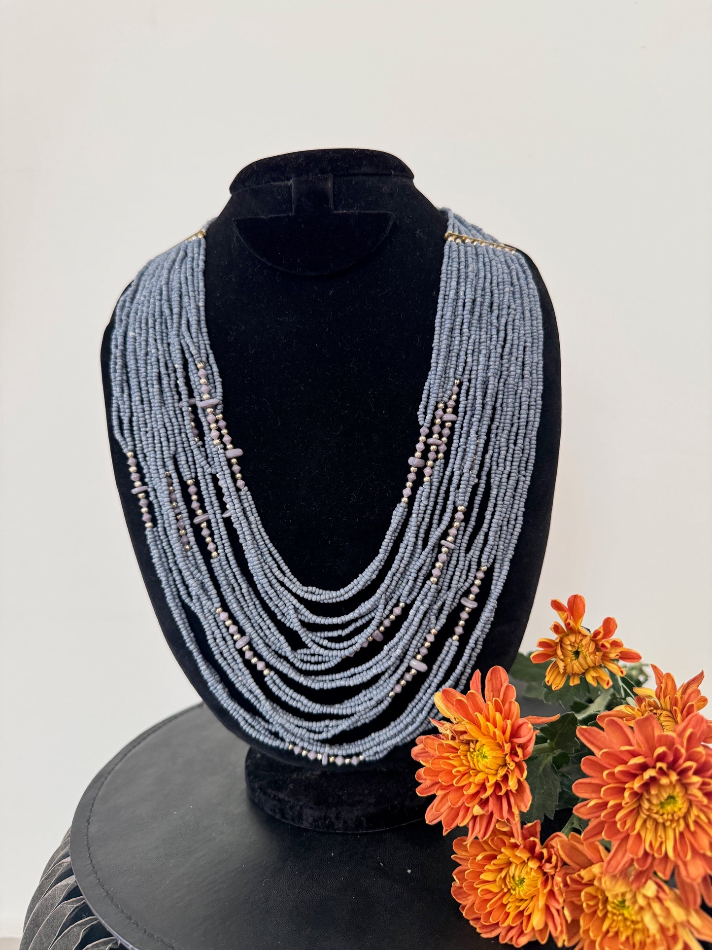 Multilayered beaded statement necklace - grey