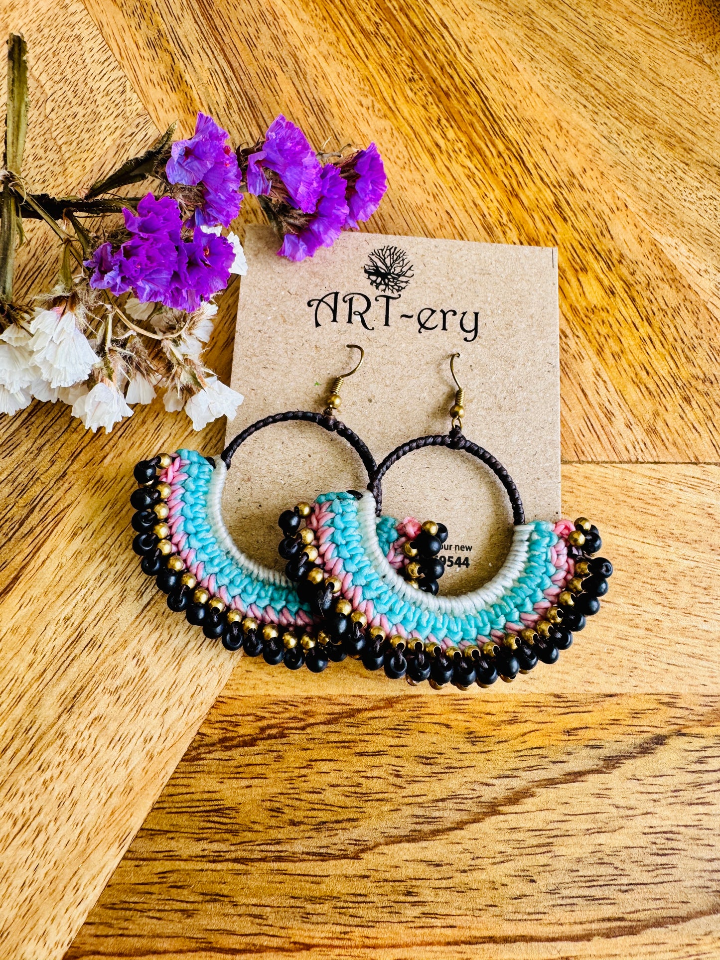 Black beaded crochet earring with blue detailing