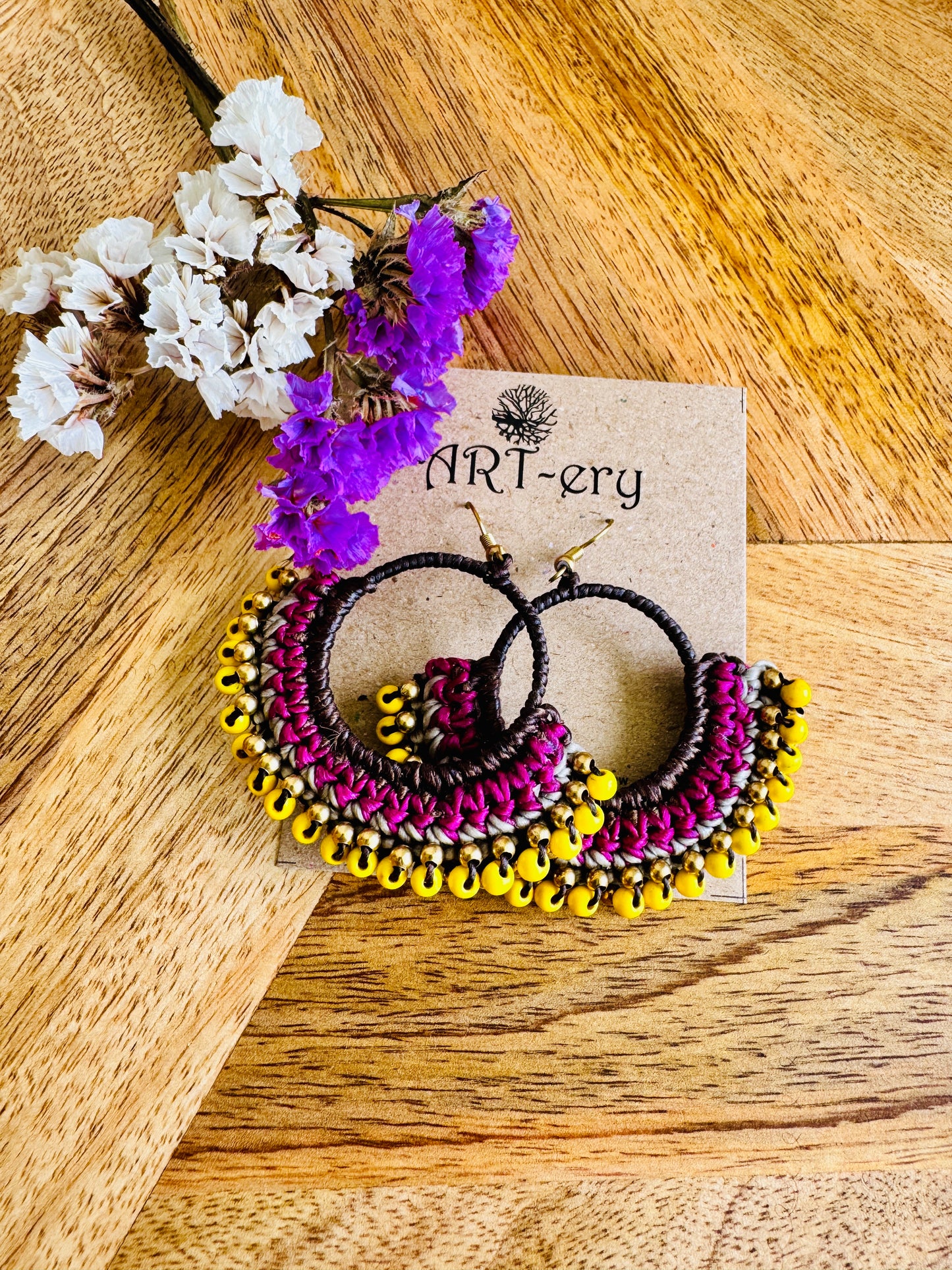 Yellow beaded crochet earring with pink detailing