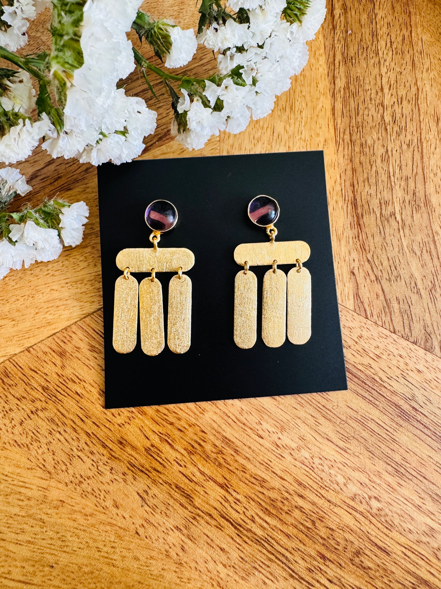 Deep red stone, dangling bars