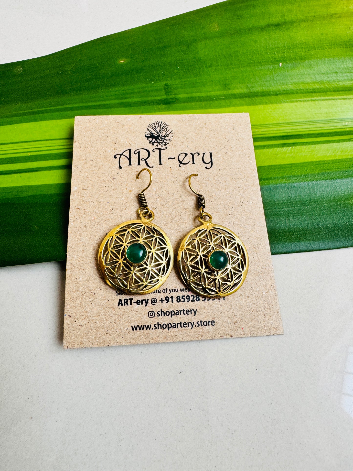 Filigree work brass earrings with blue stone