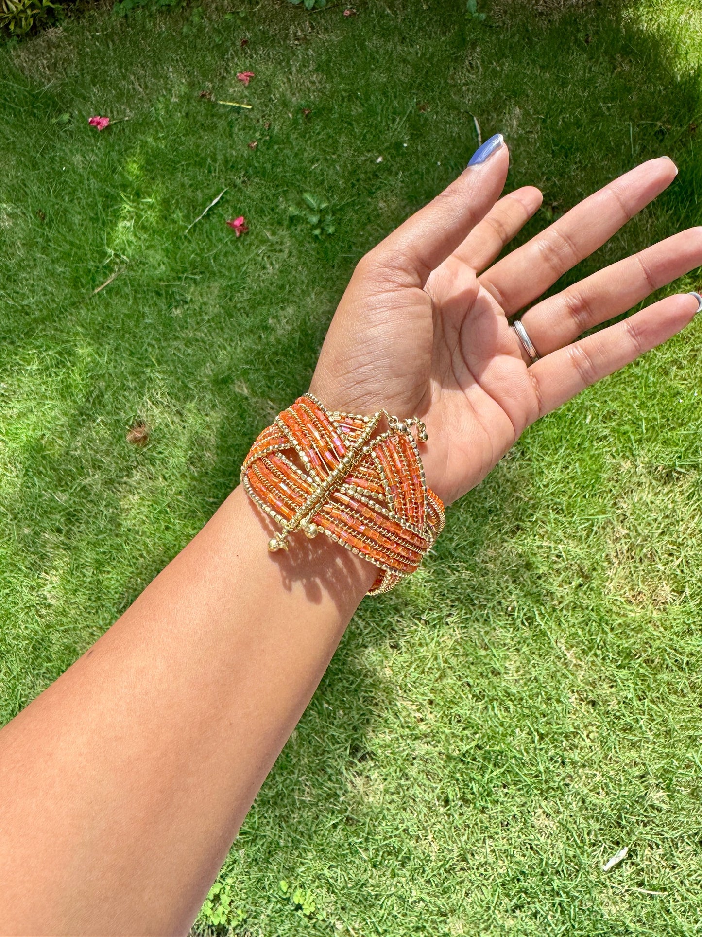 Beaded orange and gold free size arm cuff