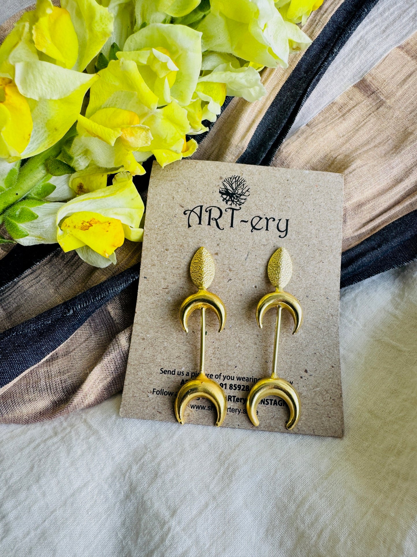 Crescent shaped brass earrings