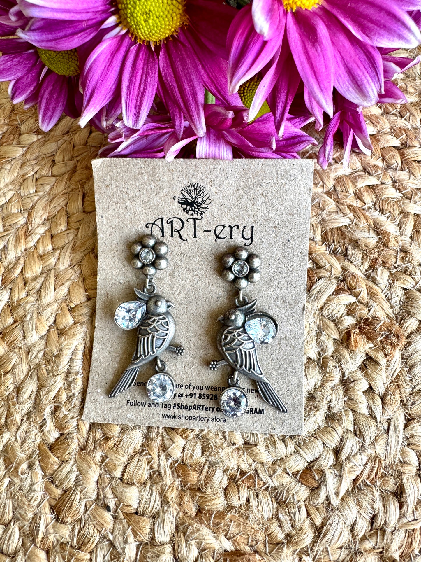 Bird look alike silver earrings - White
