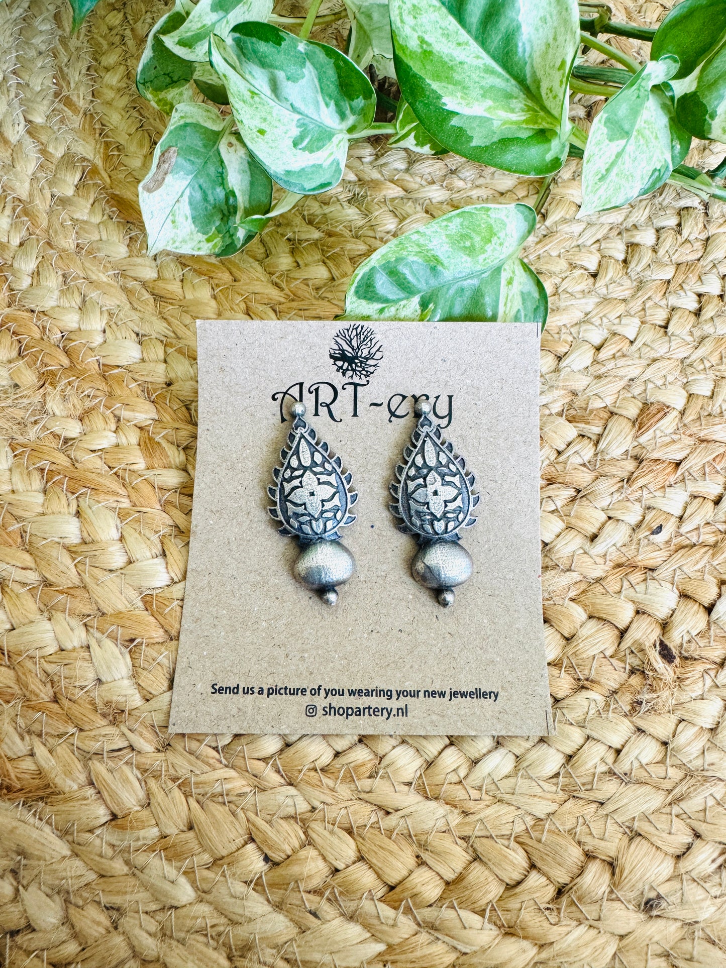 Look alike silver ethnic earring