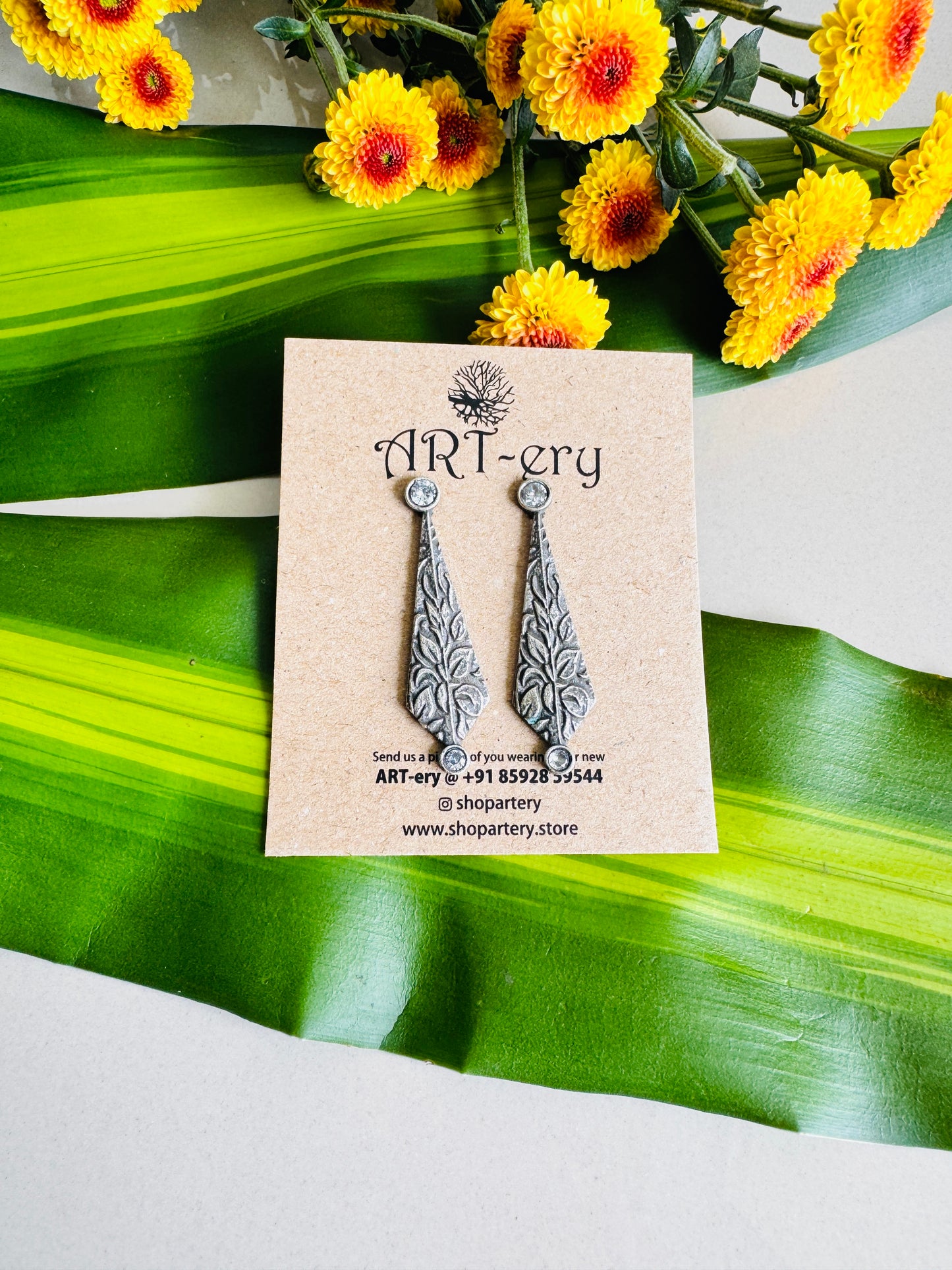 Diamond shaped earring in oxidised silver - white