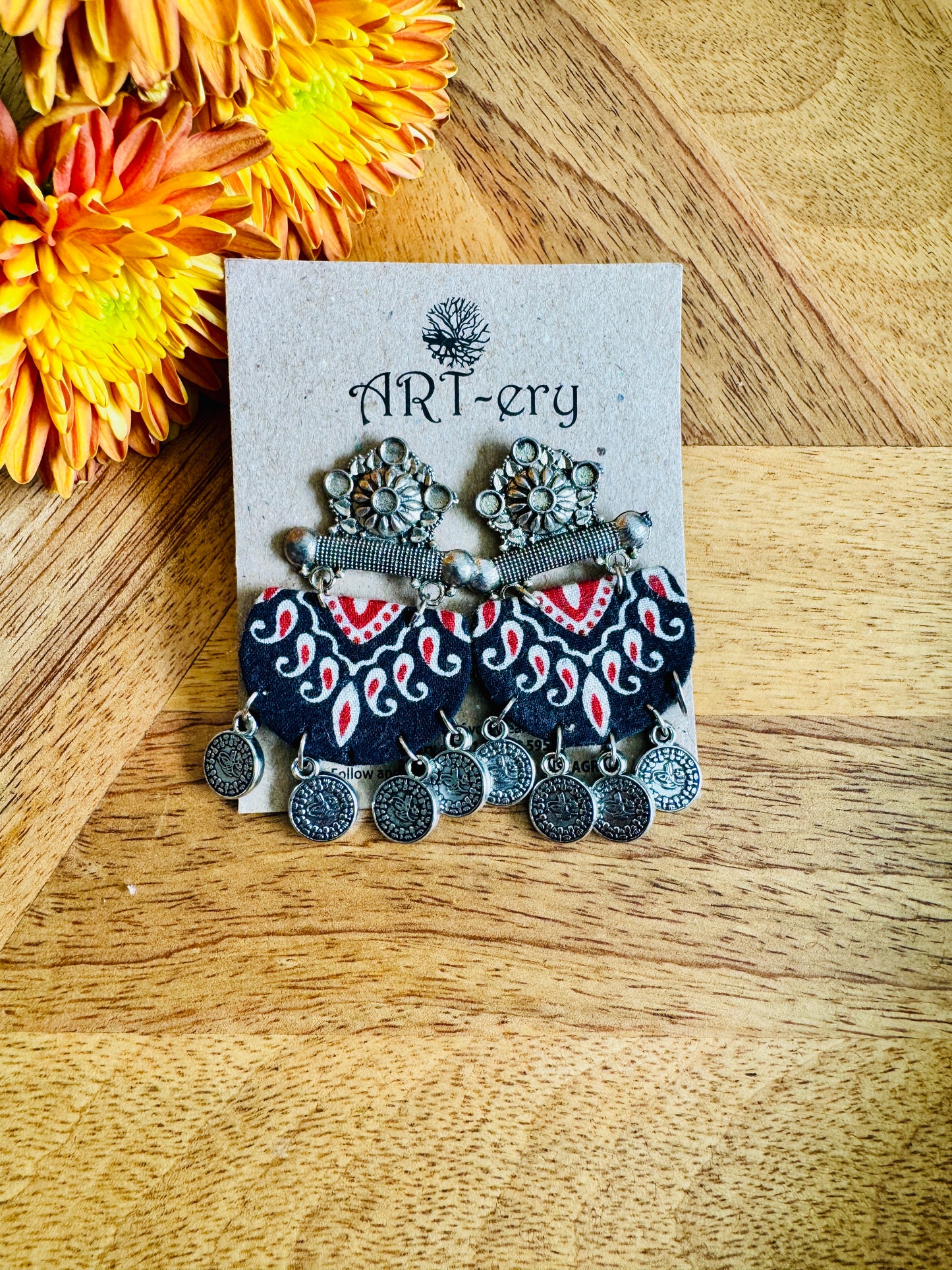 Black flame oxidised silver fabric earrings with lotus detailing