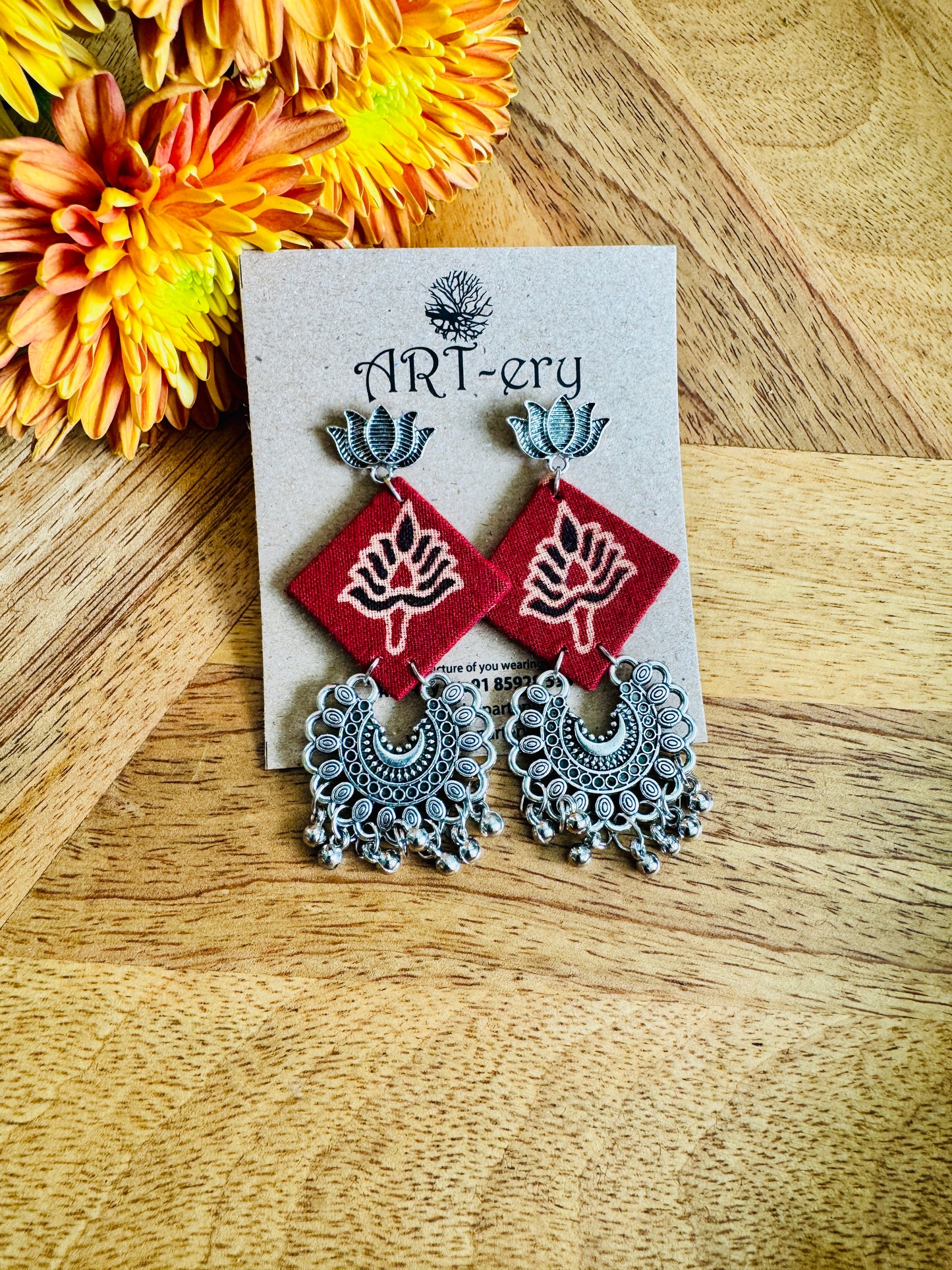 Red printed square oxidised silver fabric earrings with lotus detailing