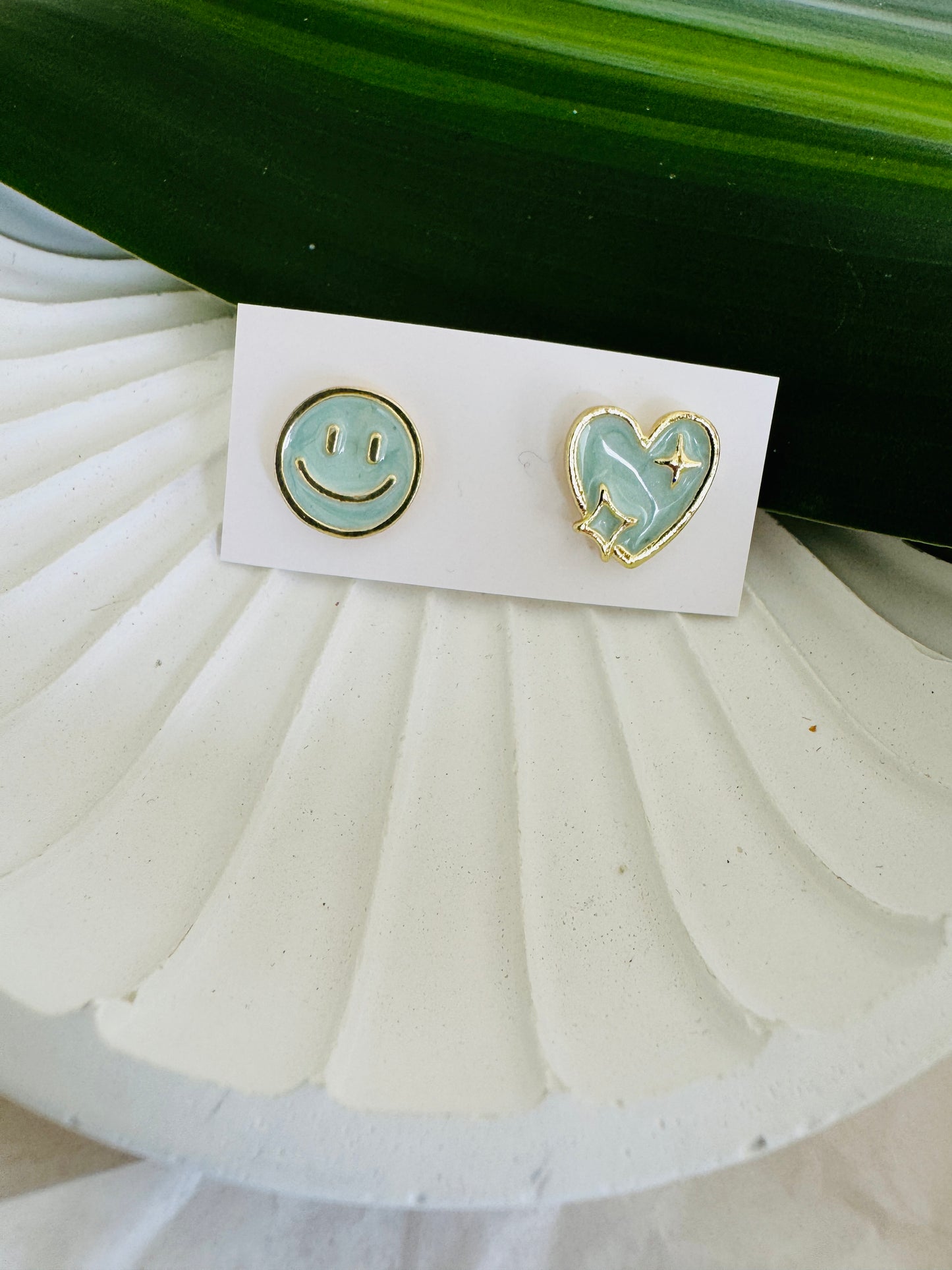 Pastel blue smiley ear studs
