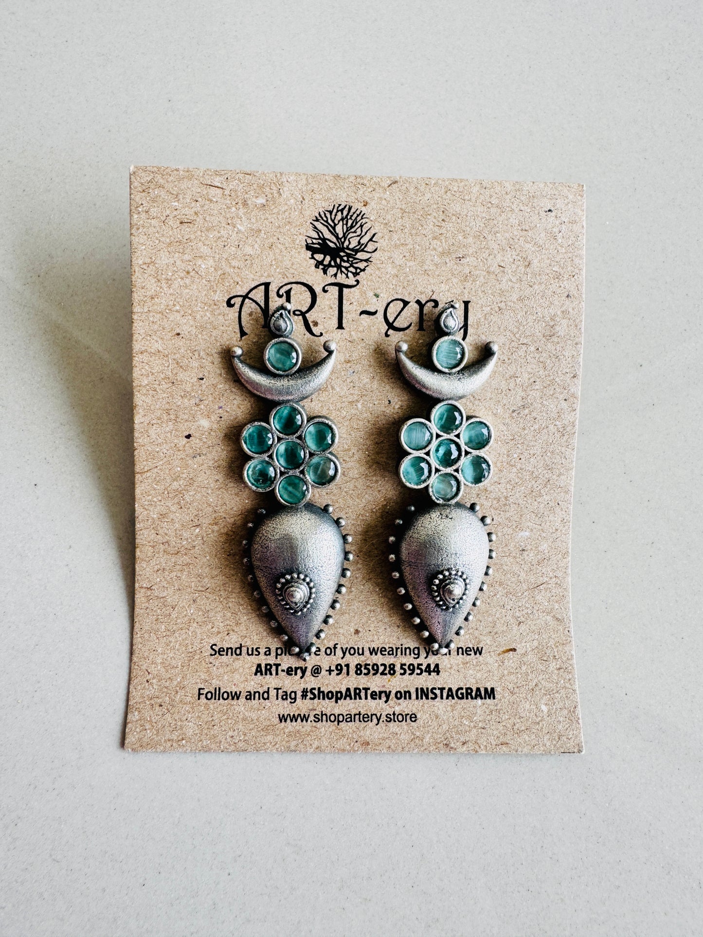 Crescent Earrings with pastel green stones
