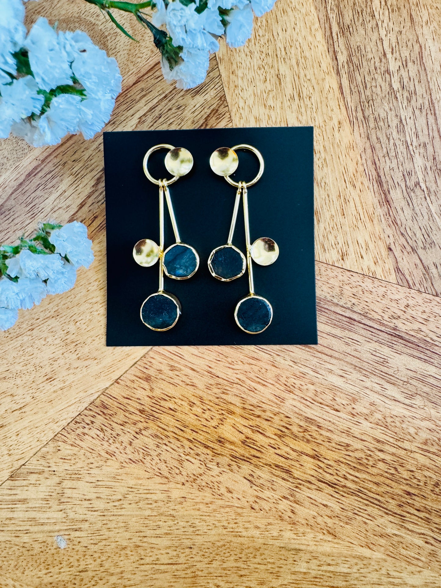 Circular deep blue stones and brass circles
