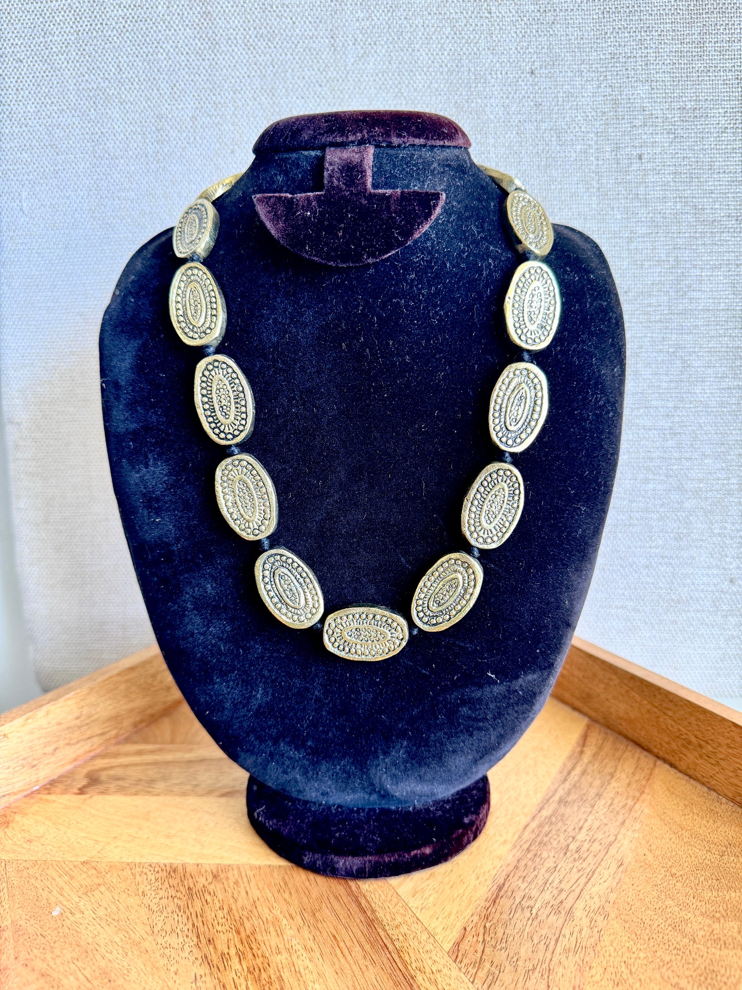 Statement metal necklace with adjustable cord