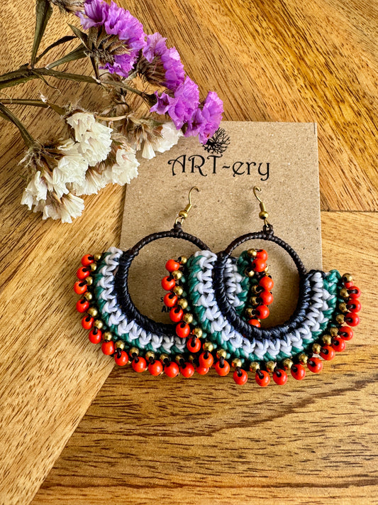 Orange  beaded earring with green detailing