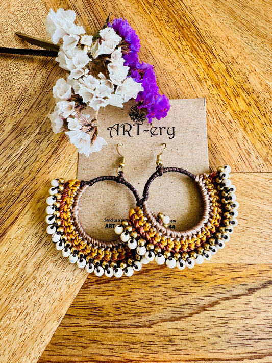 White beaded crochet earring with yellow detailing