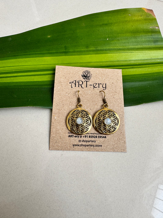 Filigree work brass earrings with light blue stone