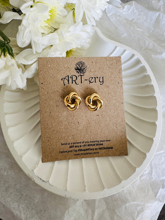 Swirl earrings in gold tone