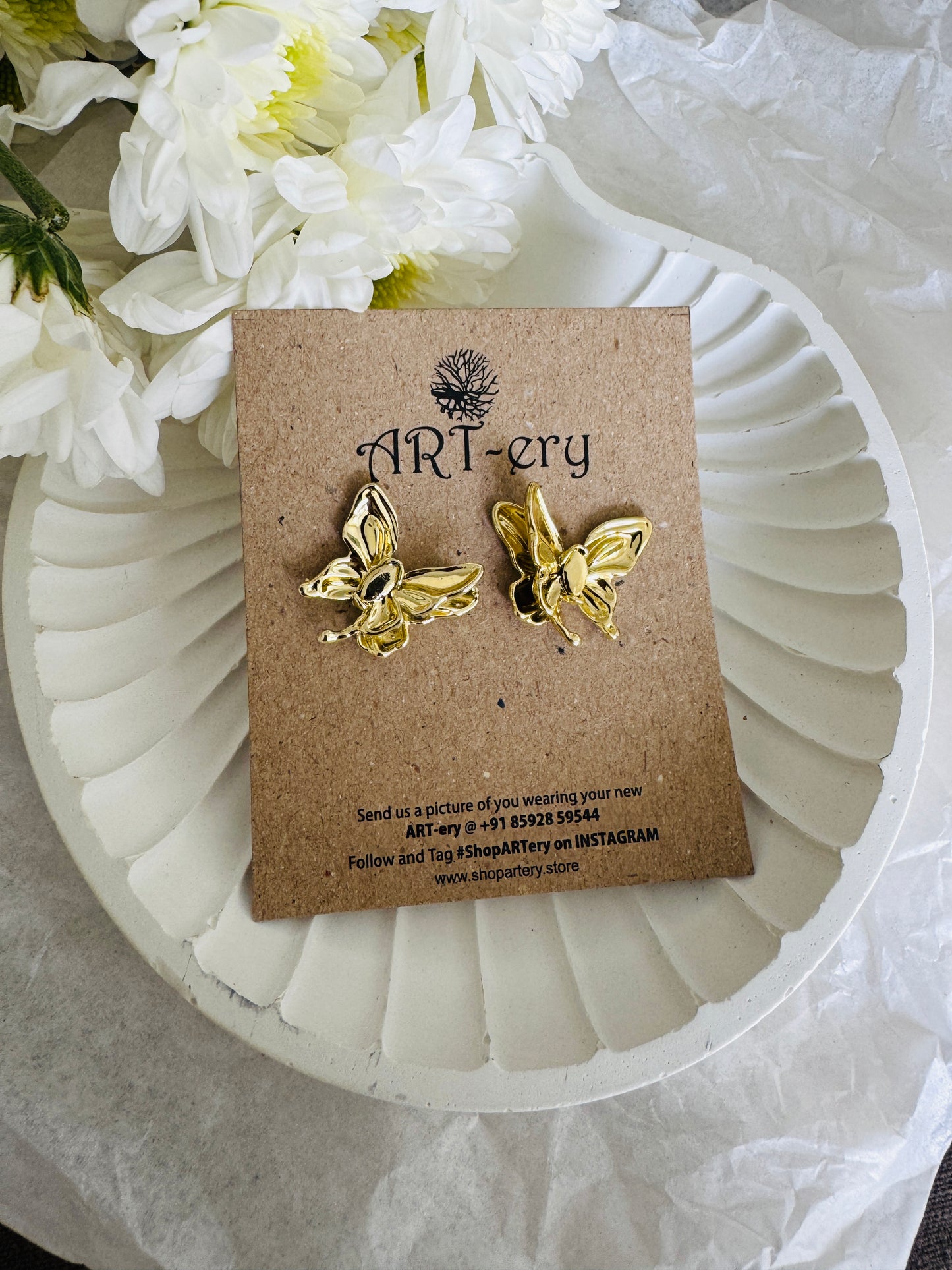 statement butterfly earrings in gold color from Trivandrum