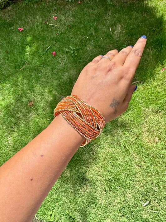 Beaded orange and gold free size arm cuff