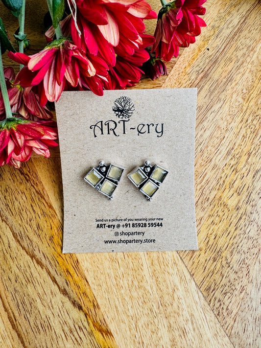 Yellow color stone triangle stud