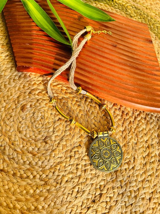 Gold tone jute thread necklace