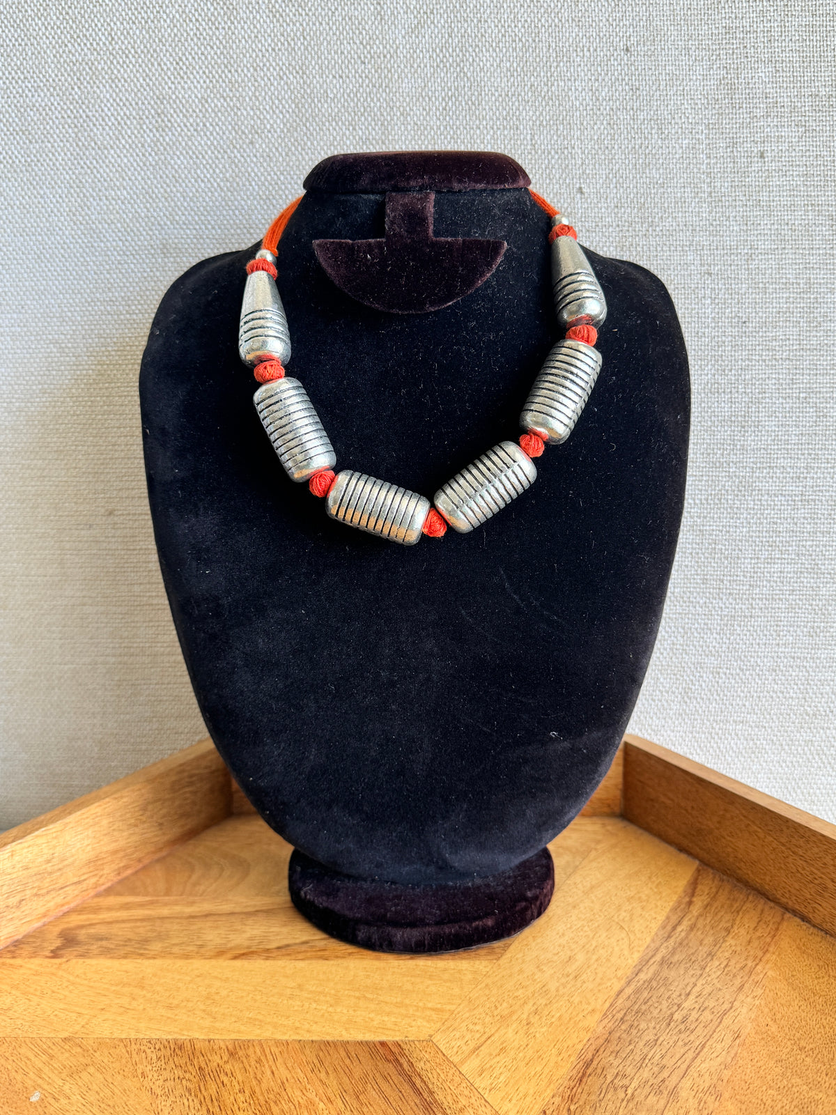 Oxidised silver metal necklace with orange thread