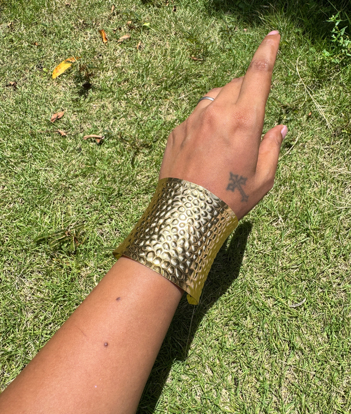 Abstract arm cuff in brass textured