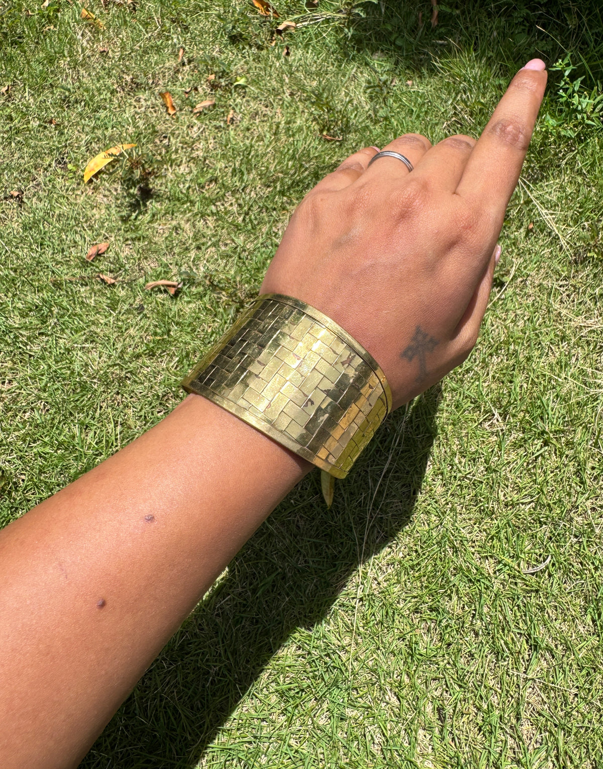 Abstract arm cuff in brass interwoven detailing